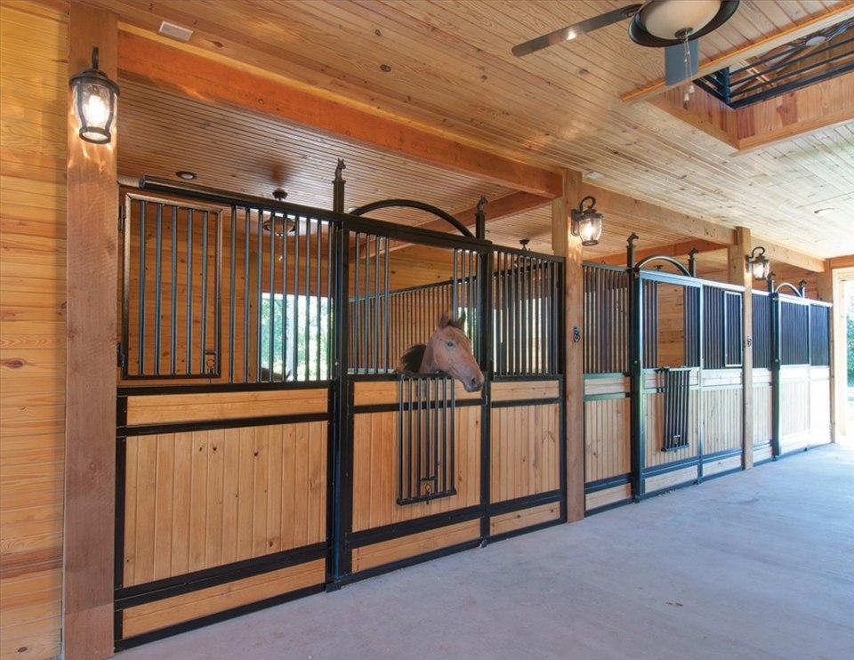 Stall Door No. 3C - Grill top, JR Elite wood load, with a hinged straight drop opening, arch over door, and custom horse-head finials
