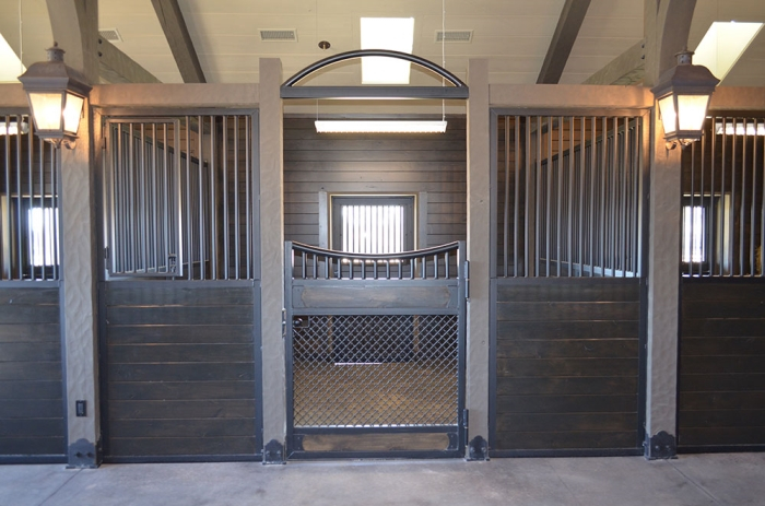 Stall Front No. 3J - Custom Hinged door stall front with mesh bottom door, grilled feed door. Decorative arch over doorway