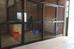 Stall Front No. 2Q - Traditional sliding door with full wire mesh throughout with European style door top