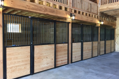 Stall Front No. 2X - Traditional Stall Front with sliding door, hinged, straight drop opening in the top, and horizontal wood load
