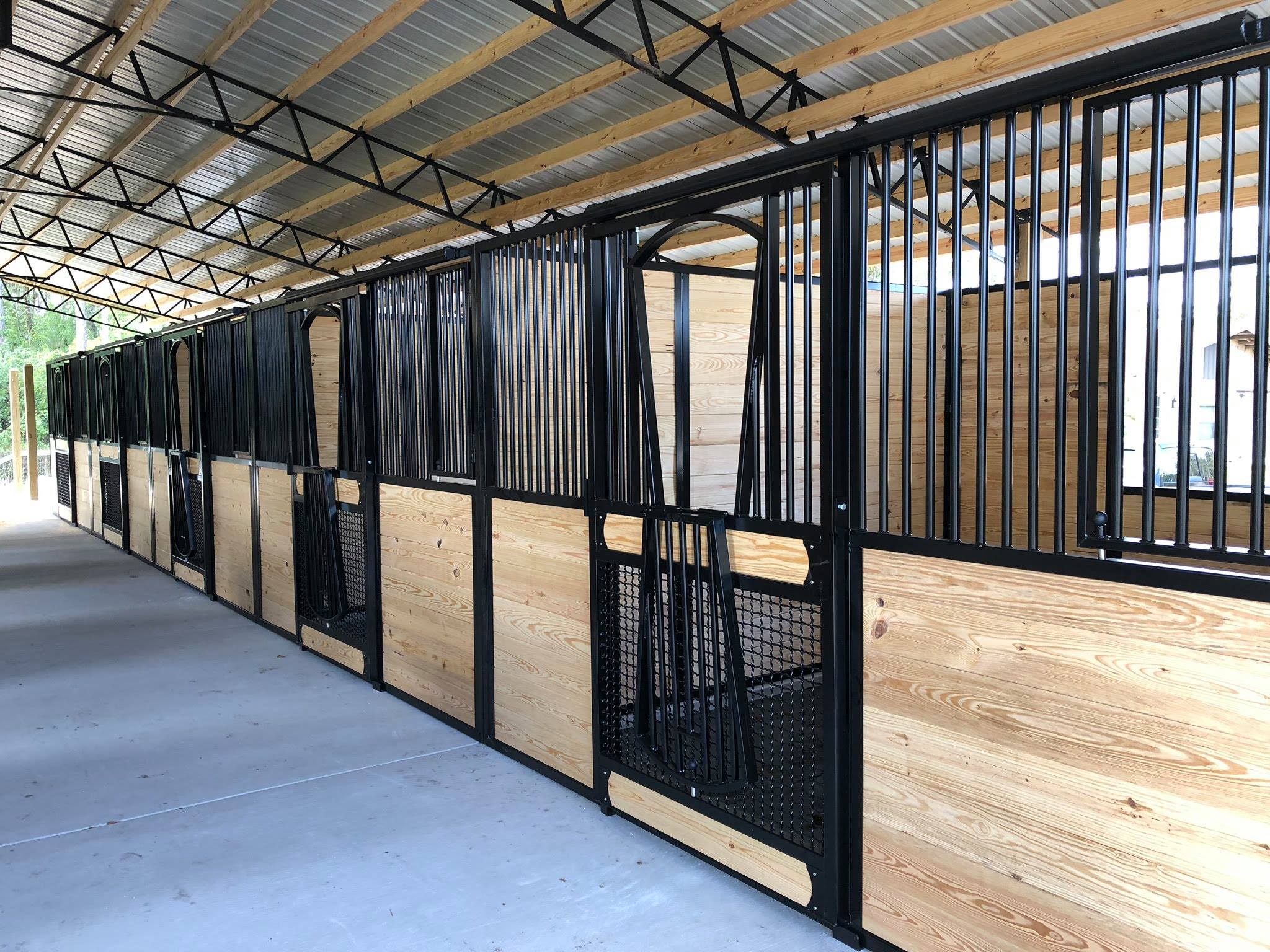 Light wood bottom horse stall fronts